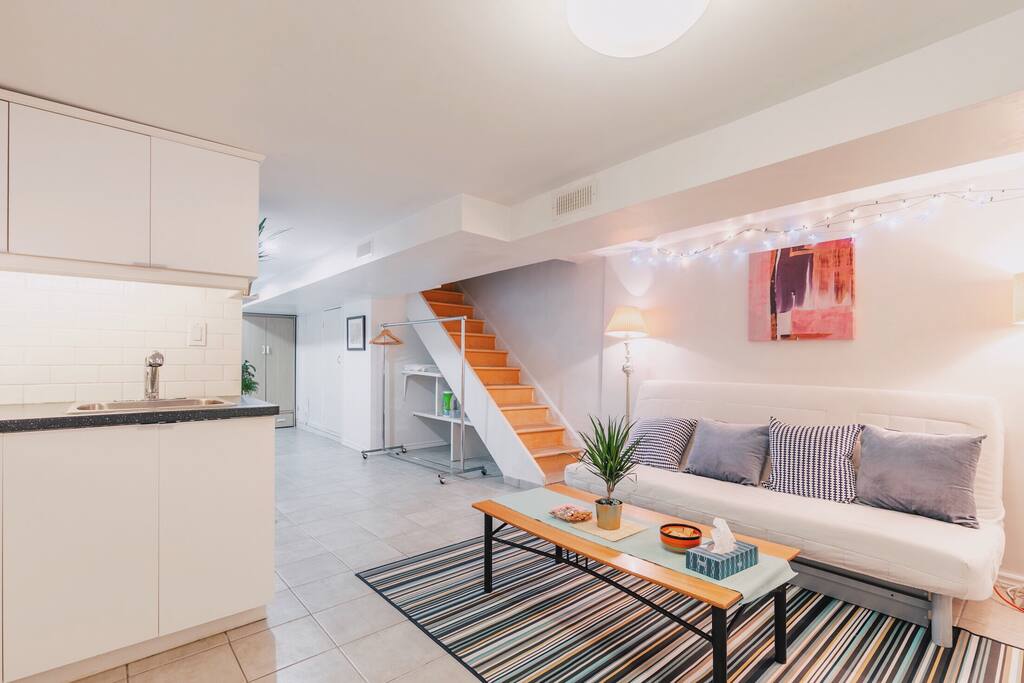 Living room with sofa bed and hallway