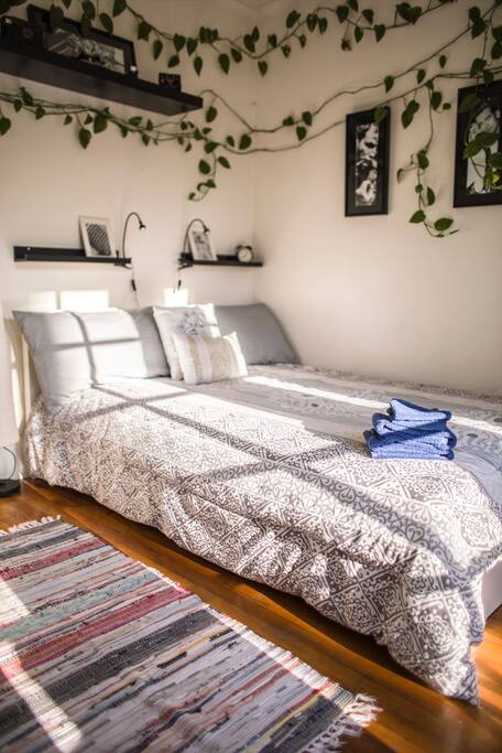 The Hollywood Bedroom with natural light coming through the french doors.