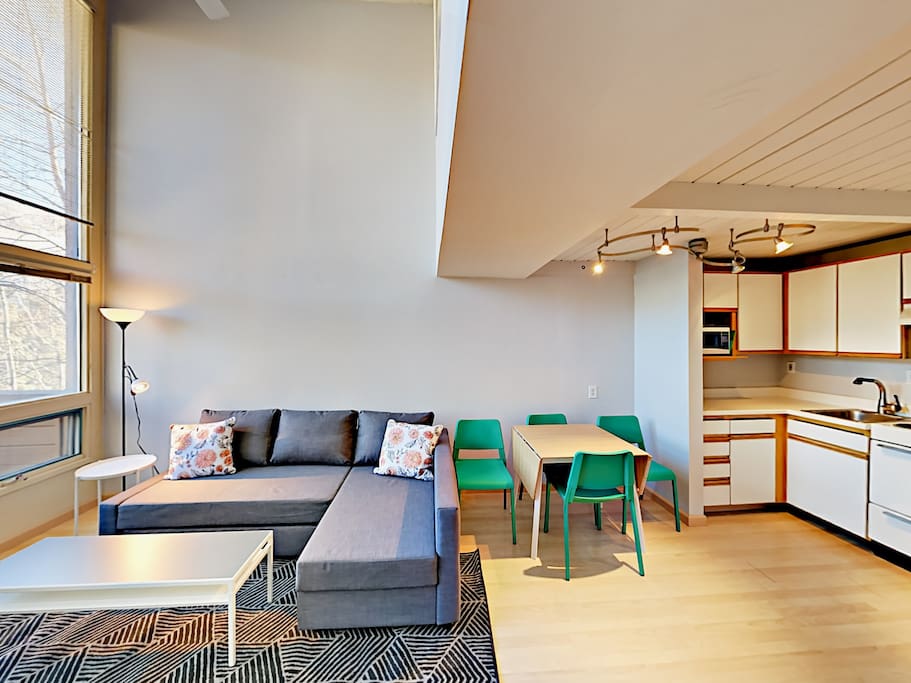Vaulted ceilings and impressive windows provide plentiful natural light.