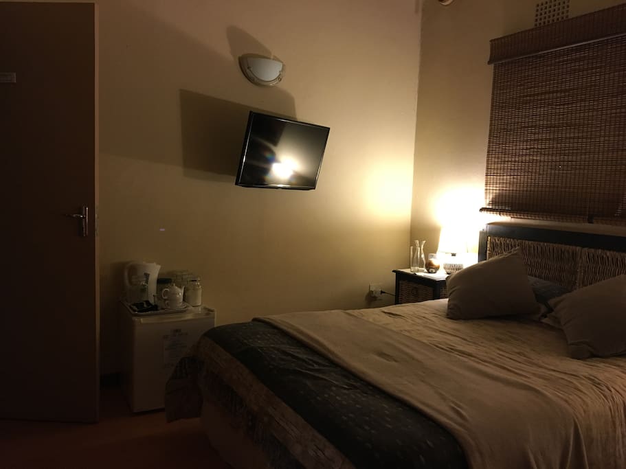 TV with DSTV, Netflix and local server. Mini fridge with refreshments available.