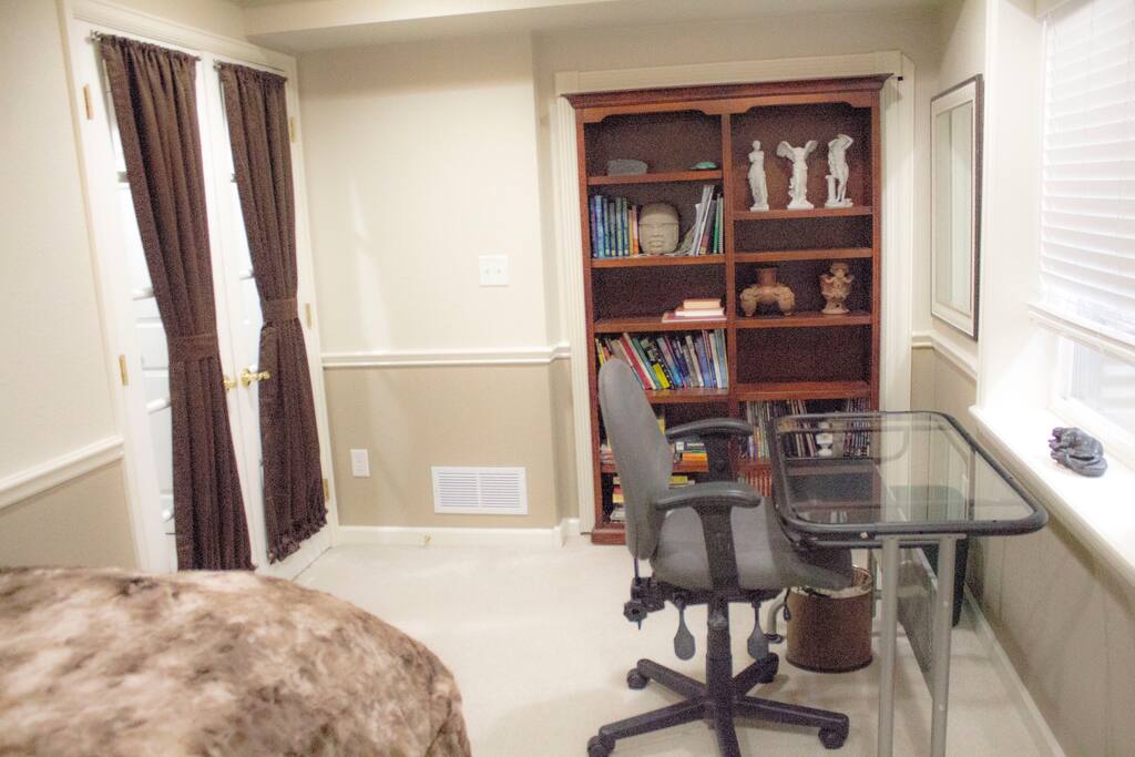 Custom bookcase is the door to the secret closet!