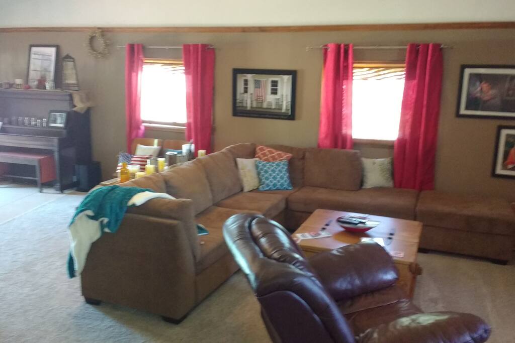 Plenty of space in the family room with a bar and bug screen tv