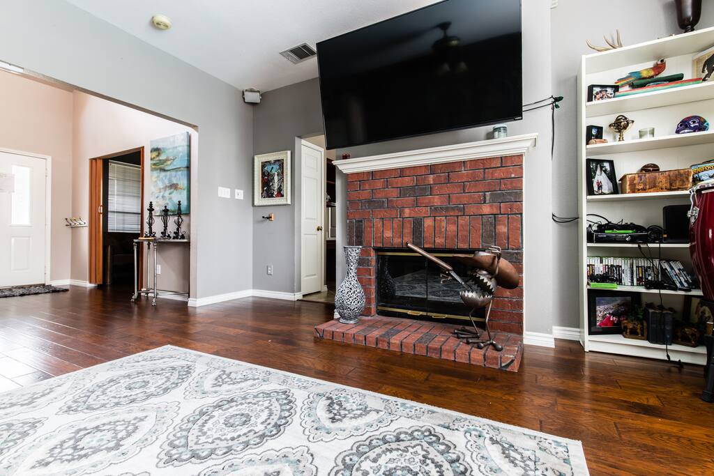 Living room with fireplace and tv