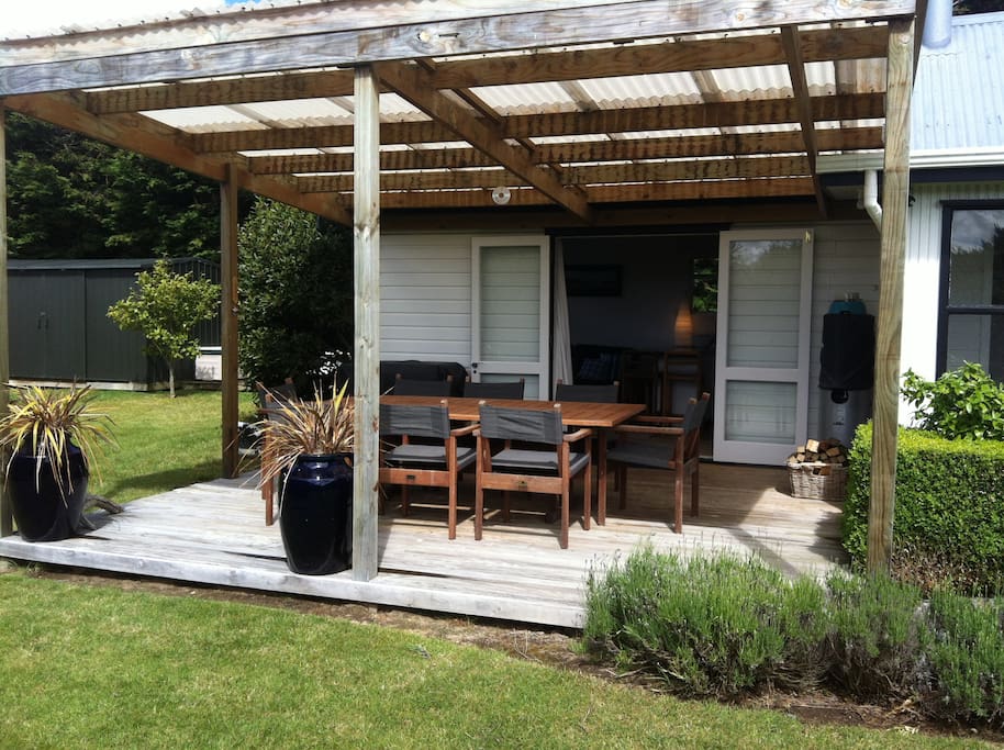 The covered deck is perfect place to enjoy sundowners. It now has side awnings too.