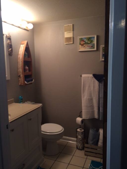 Bathroom including a bathtub and shower.