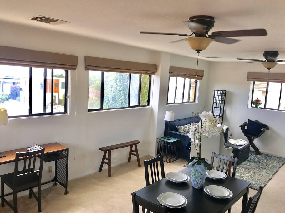 Work space and living room with pull out sofa. Custom room darkening shades, amazing views and a tv with roku to help you unwind in the evening.