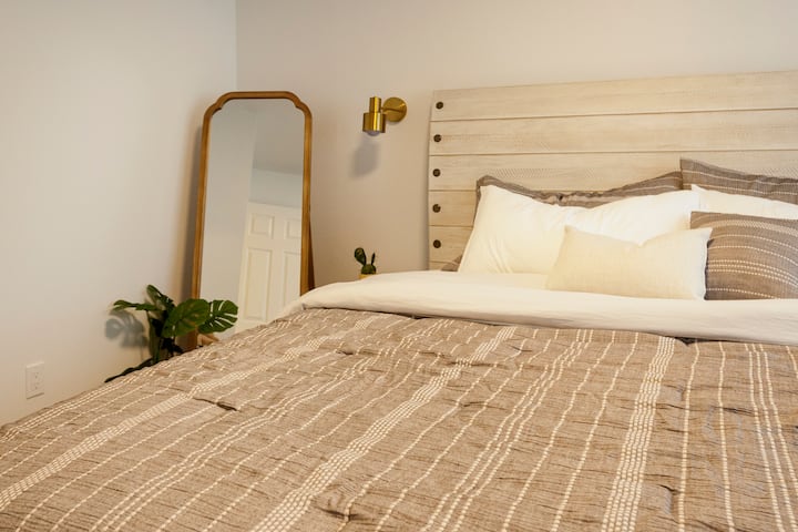 Get your rest and relax in a luxurious King bed with cooling copper infused memory foam, dual wall sconce with remotes, full length mirror, dresser, closet and a reading nook. Our fave room in the house. In this rooms closet we have included an iron