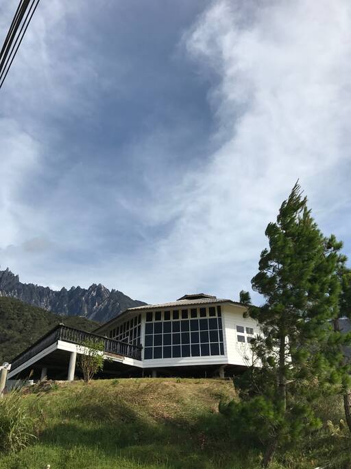 This is Strawberry House as you walk by from another angle, as you can see it is slightly raised on the slope and Mount Kinabalu is behind