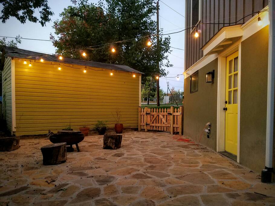 The patio outside your room. Your room is through the yellow door.