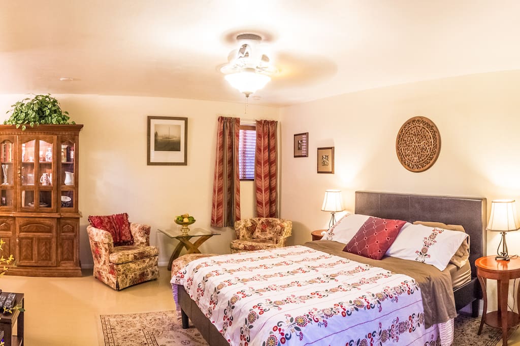 It has a small sitting area for relaxing and watching TV.