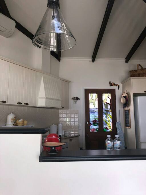 Stunning leadlight door leads to private courtyard.