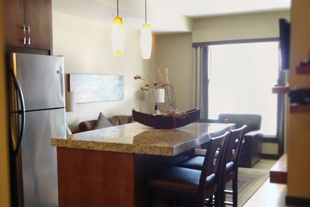 Spacious, light kitchen and living area with a large island