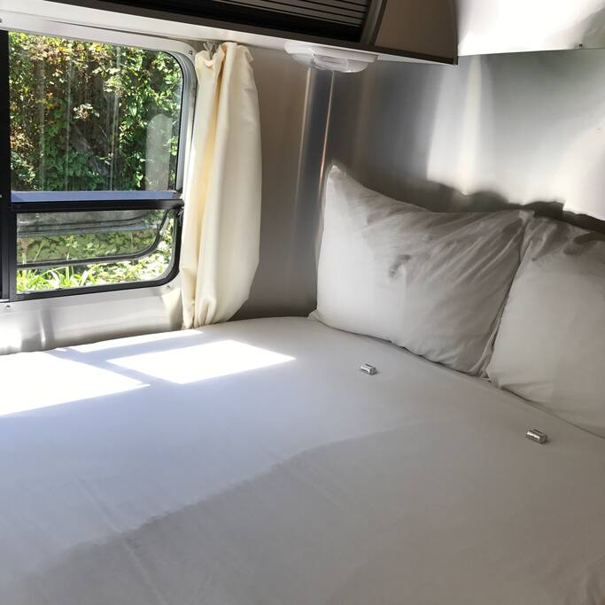 Our guests love the comfortable bed! "What a treat! I had never stayed in a new Airstream before and this one is NICE. We arrived to soft music playing in the trailer and chocolates on our incredibly plush and comfy bed." - July 2017 review