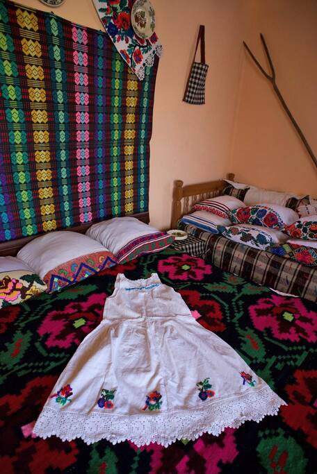Traditional wall hangings, bed spreads, cushion covers and emboidered under skirt in our Triple Room