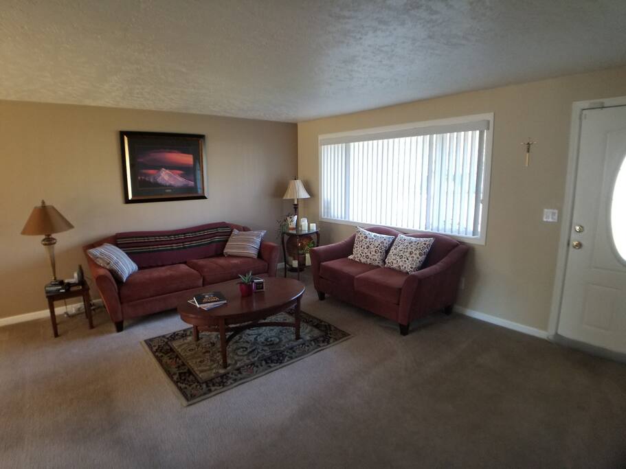 Common area living room connected to kitchen space.