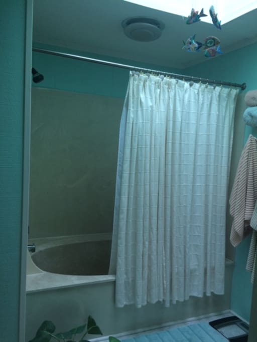 Bathtub upstairs with shower. 1/2 bath off kitchen with outside shower closet