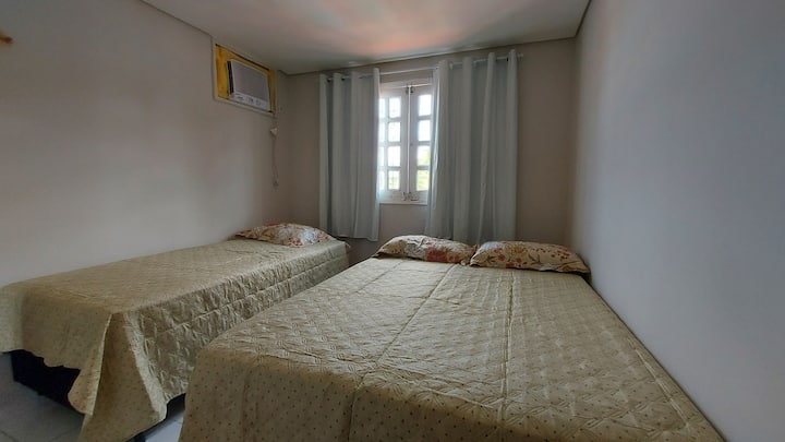 Bedroom 2 - 1 double bed, 1 single bed, dresser, air conditioning and black-out curtain
