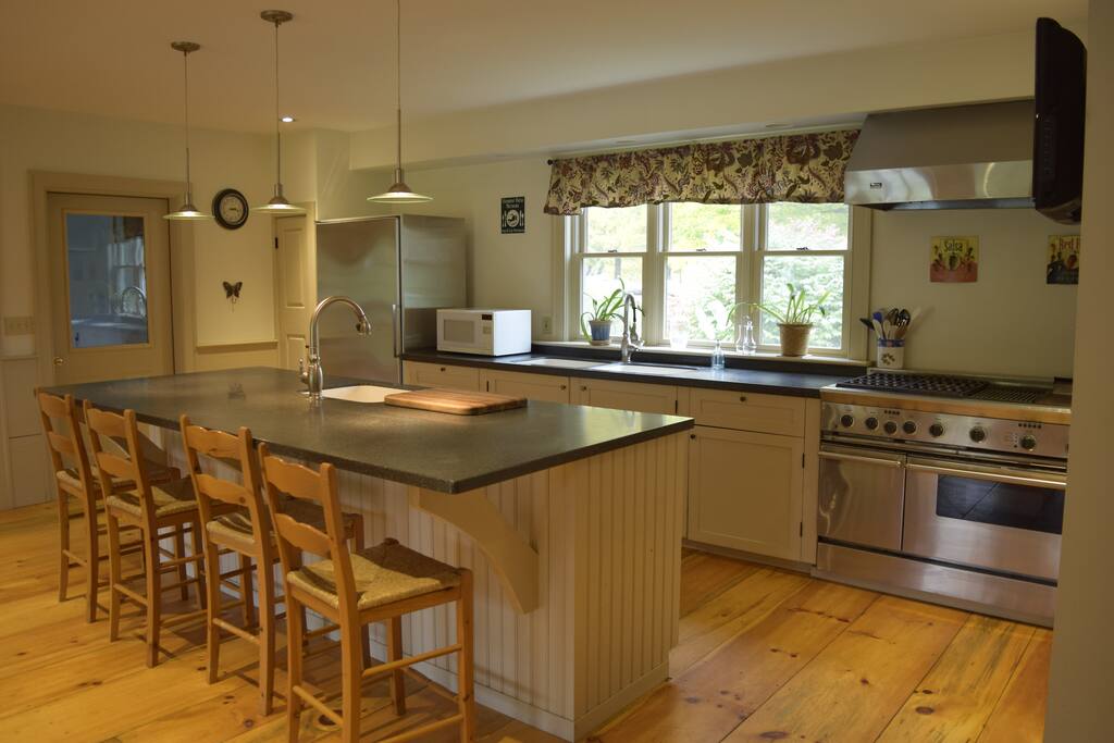 Huge kitchen with an island, 48 inch Thermador stove to cook with and a nice lounge area to enjoy while relaxing in the kitchen area.