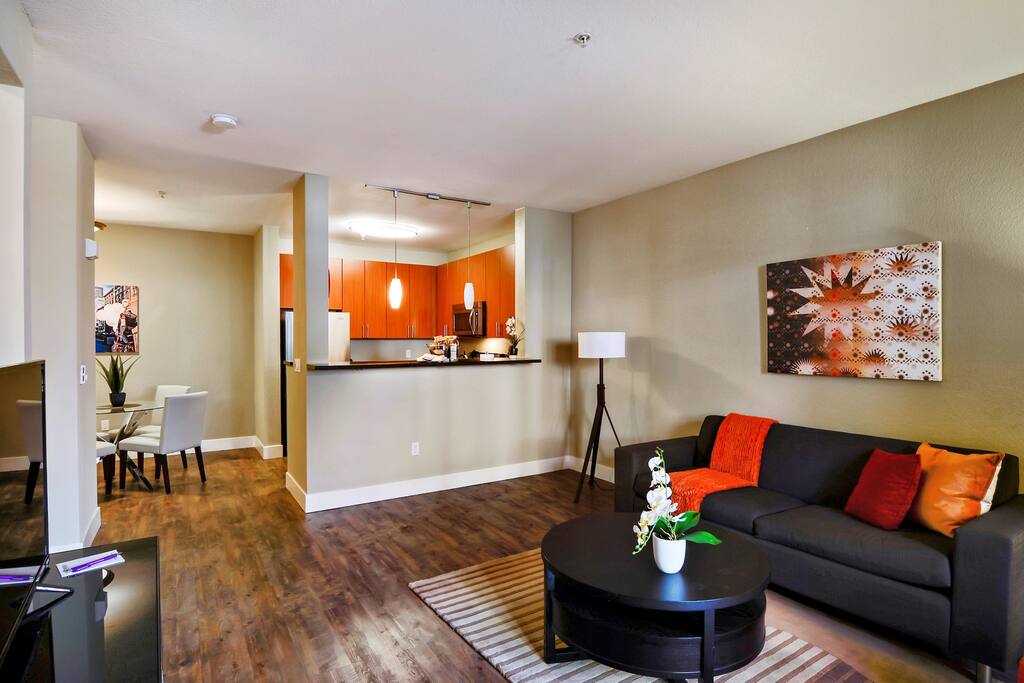Living room with view into dining room and kitchen
