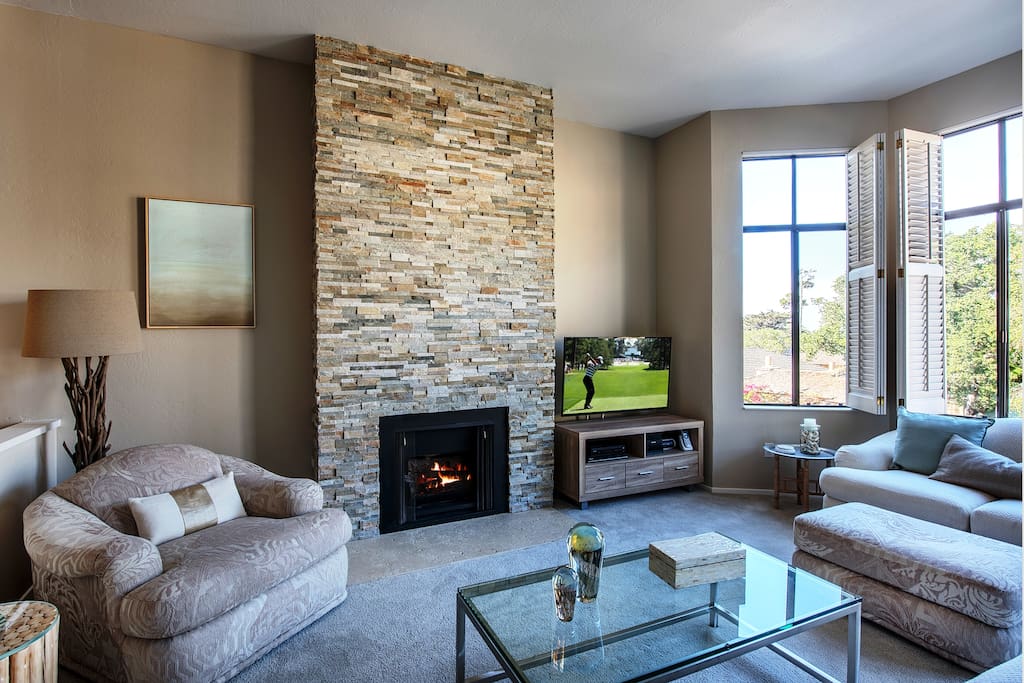 Hand-crafted gas fireplace made of stacked stone.
