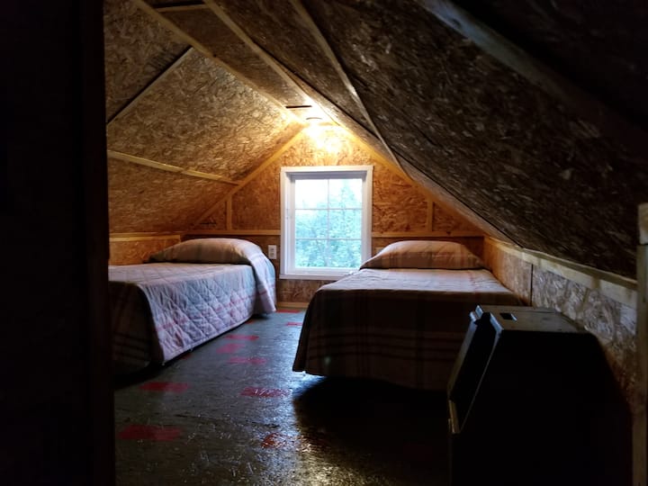 The loft which is the second sleeping area. Two single beds.