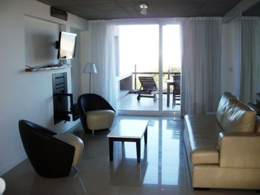 Living Room . Wide window with seafront view