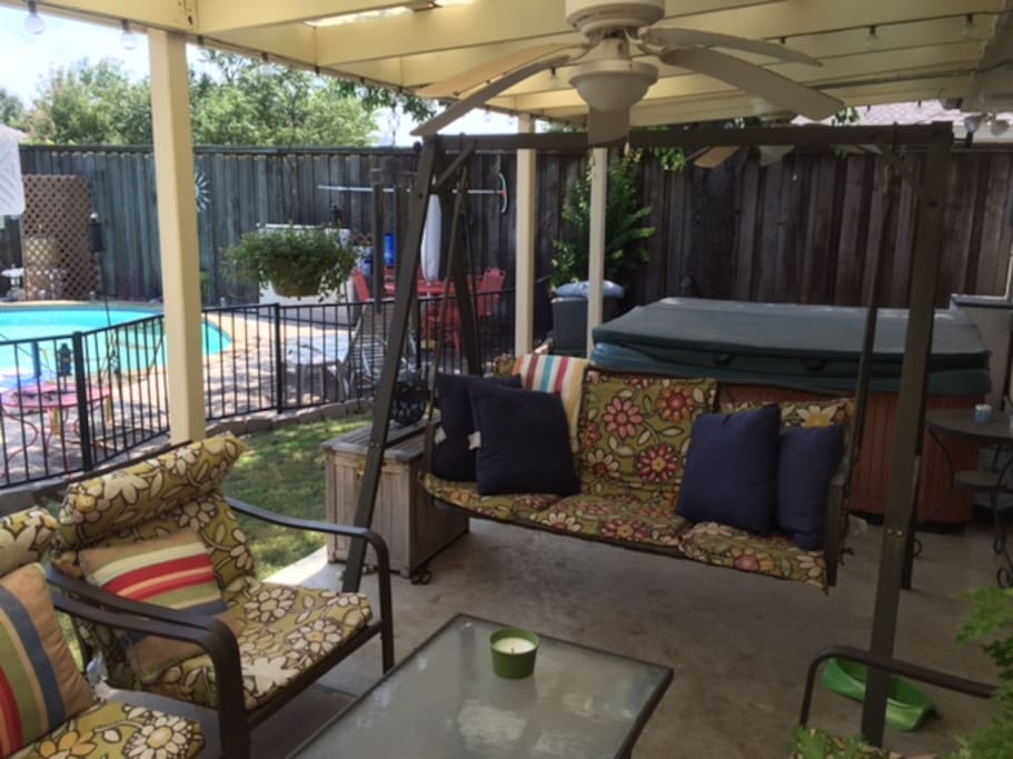 Relax under the covered patio (with lights and ceiling fans) or in the 7 person hot tub.