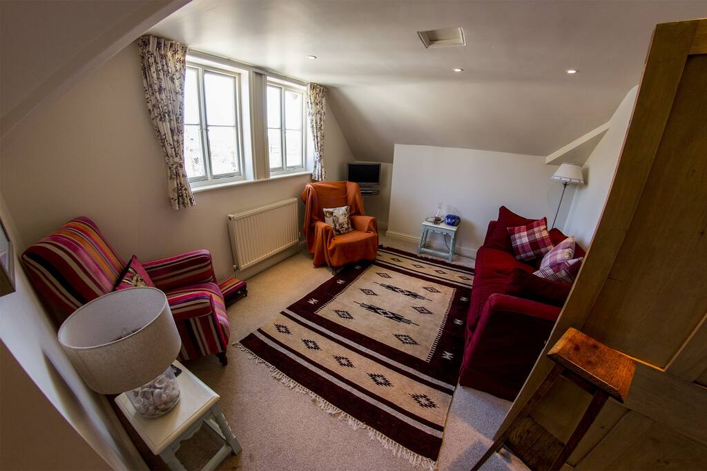 Sitting room in the Apartment with TV and DVD player. Far reaching views over the surrounding countryside.