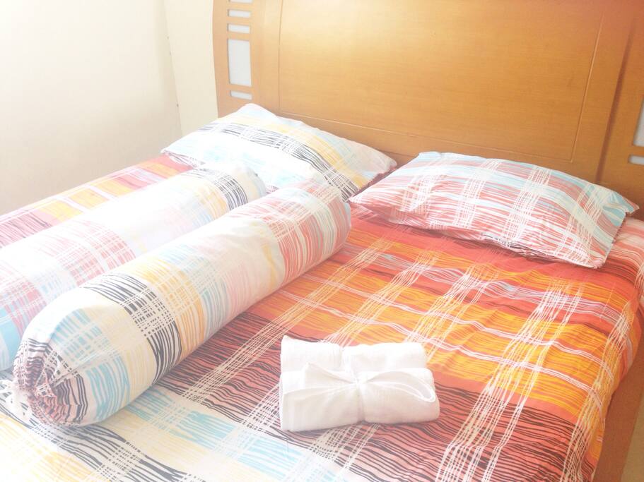Comfortable bed with fresh bed linen
