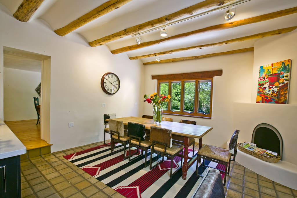 The heart of the house with Santa Fe style furnishings, hearth and beautiful coved plaster ceilings.