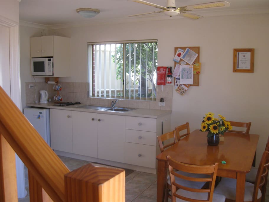 Fully equipped kitchen high chair and stair guards available .