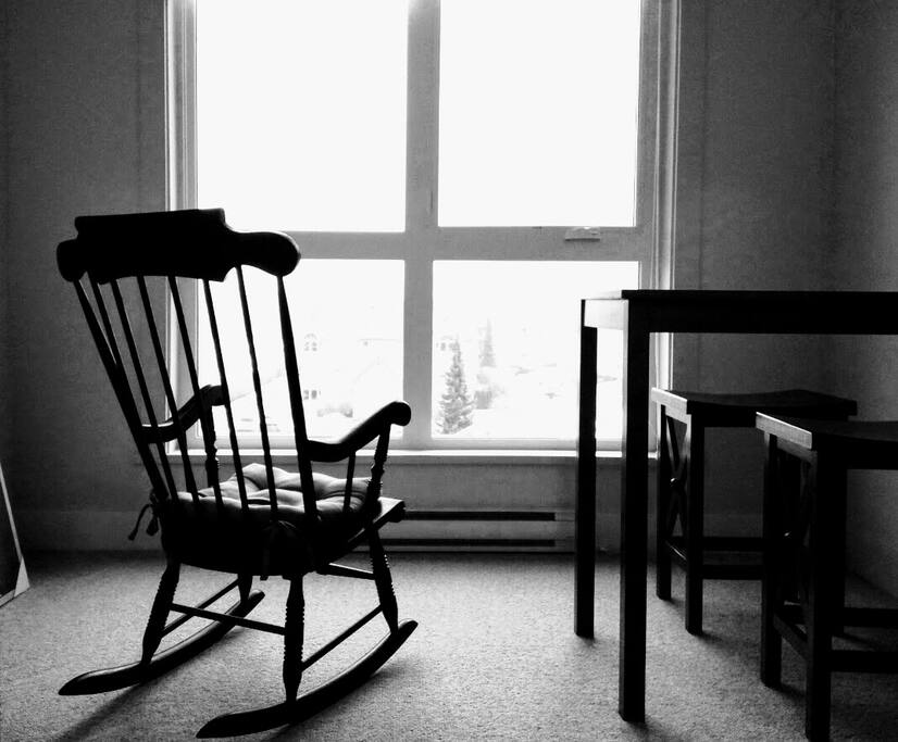 Private Area with Height Table and Chairs for Eating and Rocking Chair for Viewing