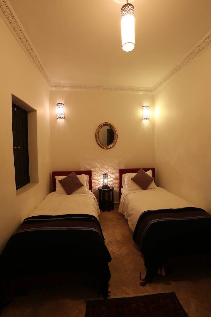 The two twin beds in the Apple room make this a good option for groups or families. There's a beautiful terrace outside of this room and a wonderful bathroom as well.