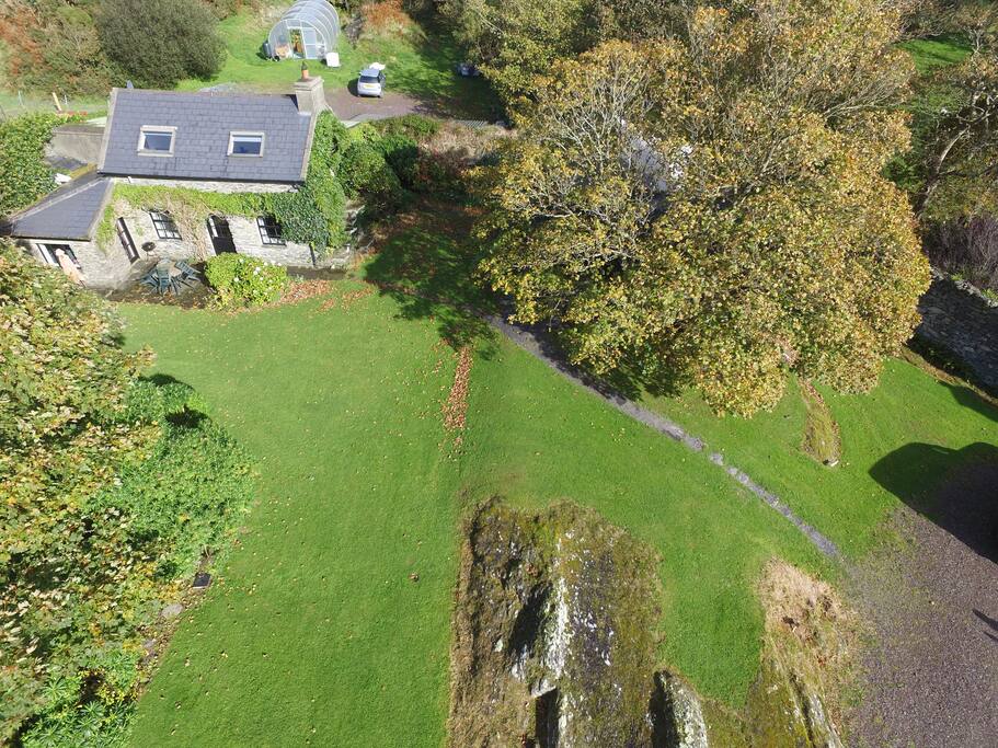 Ariel photo of the Cottage set in beautiful autumnal landscaped gardens