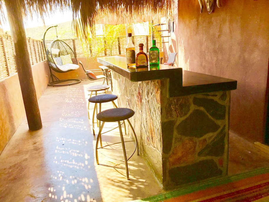 Outdoor bar area with sink.