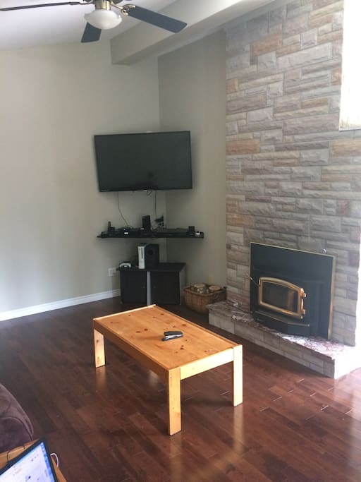 Living Room w/ 55" TV, Couch and 2 recliner chairs