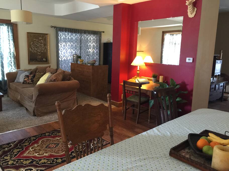 Dining room, chatting room, and kitchen. The mirror is popular for getting ready for a night out.