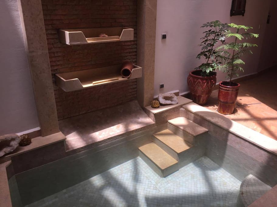 Indoor pool with water cascade