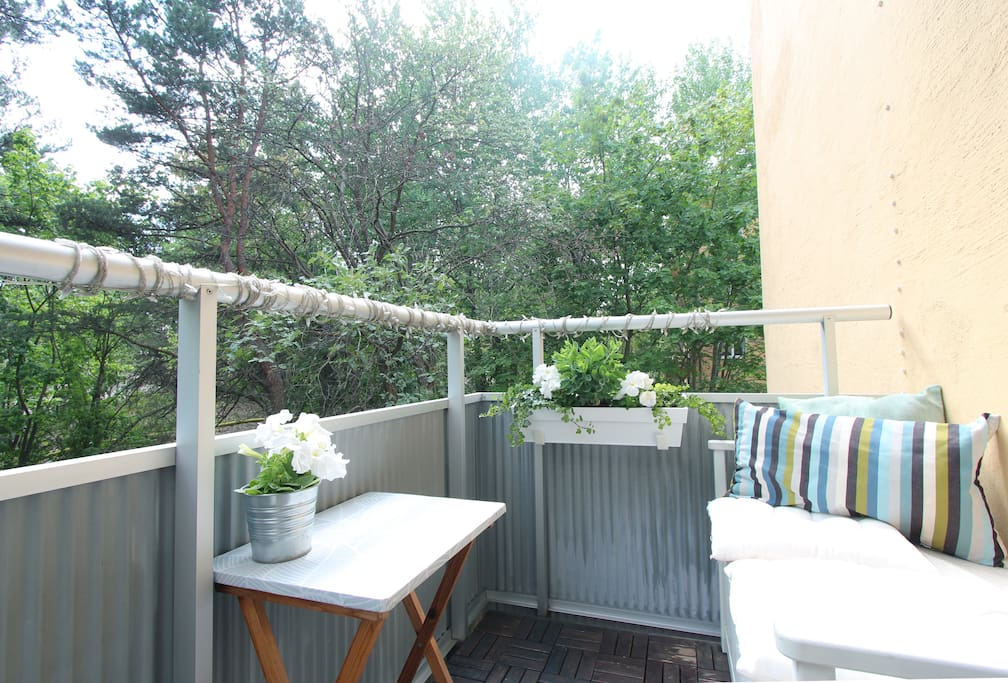 SUNNY BALCONY FACING SOUTH AND A GREEN LUSH AREA