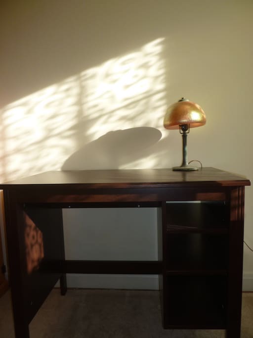 writing desk in bedroom with single/twin bed