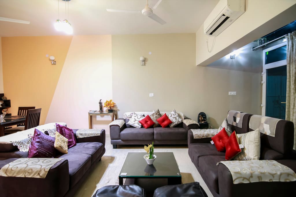 A Spacious living room with cosy sitting ,ample natural light and beautiful view with 50"TV with over 100 channels access.