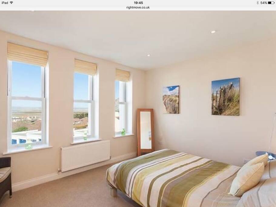 Spacious bedroom with sea views