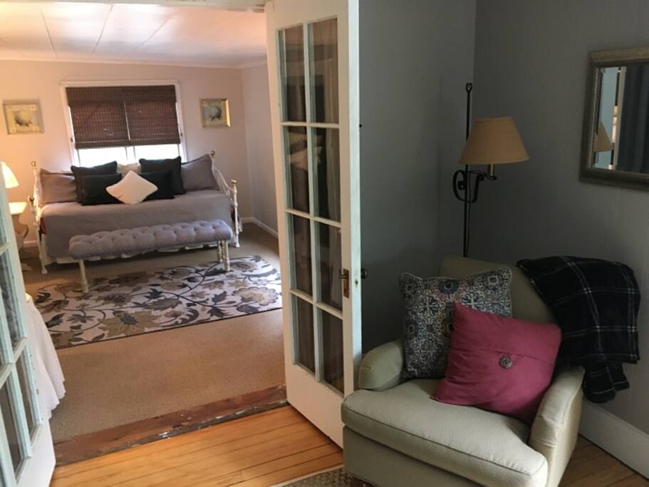 Looking through the Putnam Suite at the second room with day bed