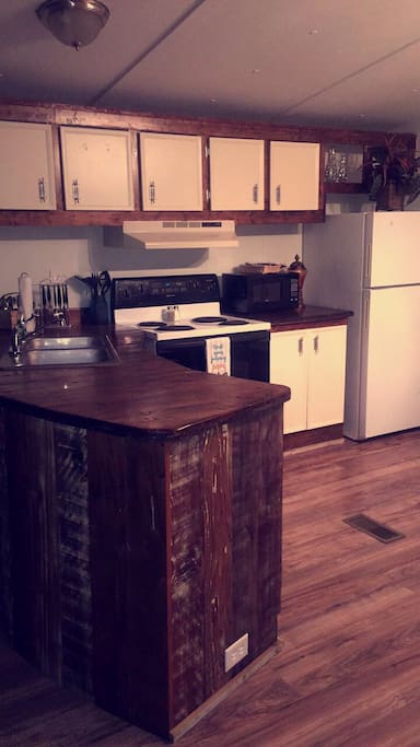 Fully stocked kitchen included crock pot and some condiments in the fridgee