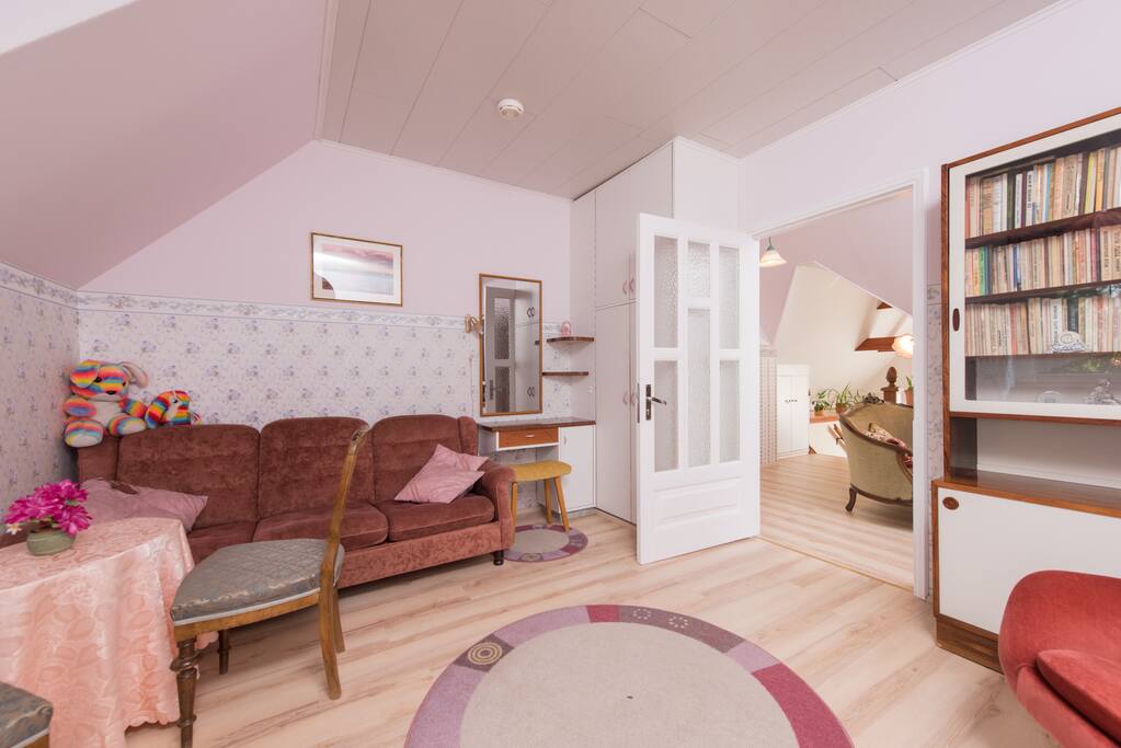 The bedroom with a singlebed and a couch