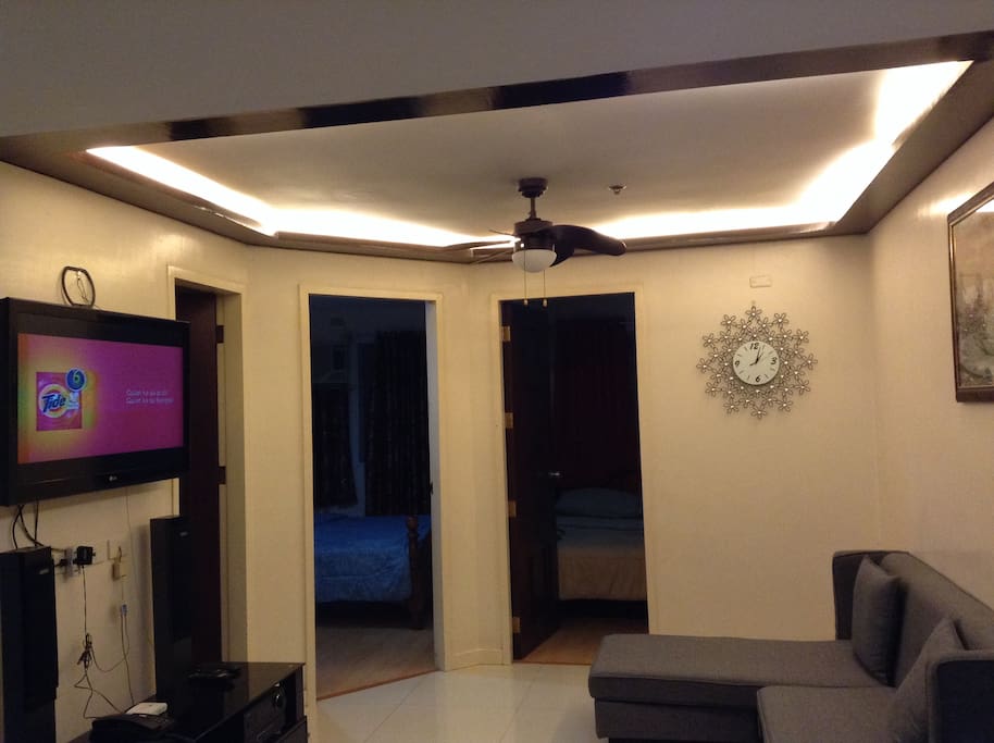 Main room, doors to bathroom & bedrooms