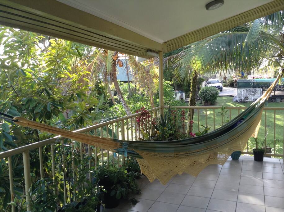 Be at ease. Listen to the birds as you relax in our hammock.