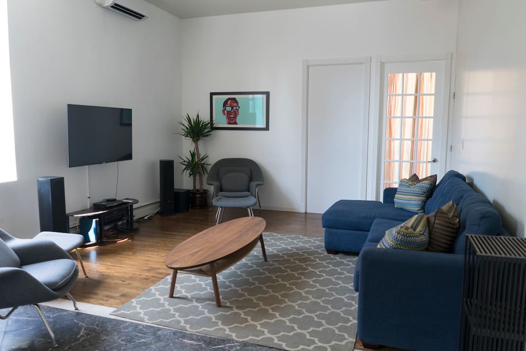 Living room with designer furniture and newly installed sound system