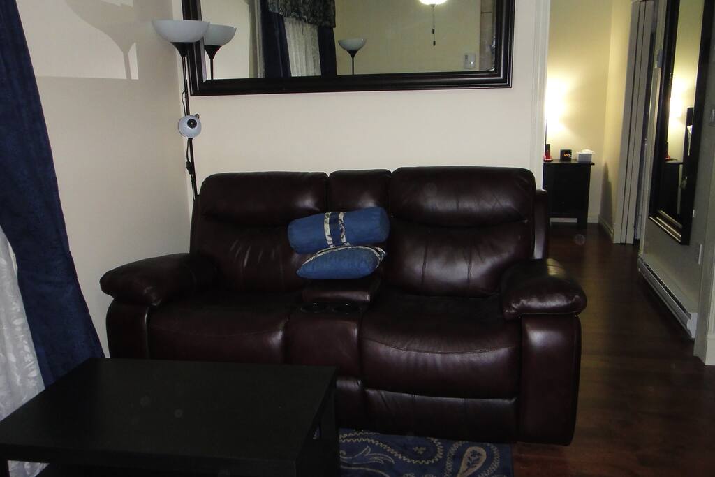 Power reclining leather loveseat.