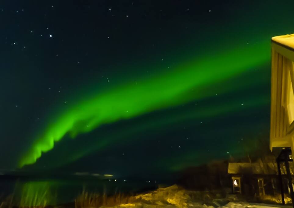 Aurora Borealis visiting Straumen Sea View, as seen from the patio